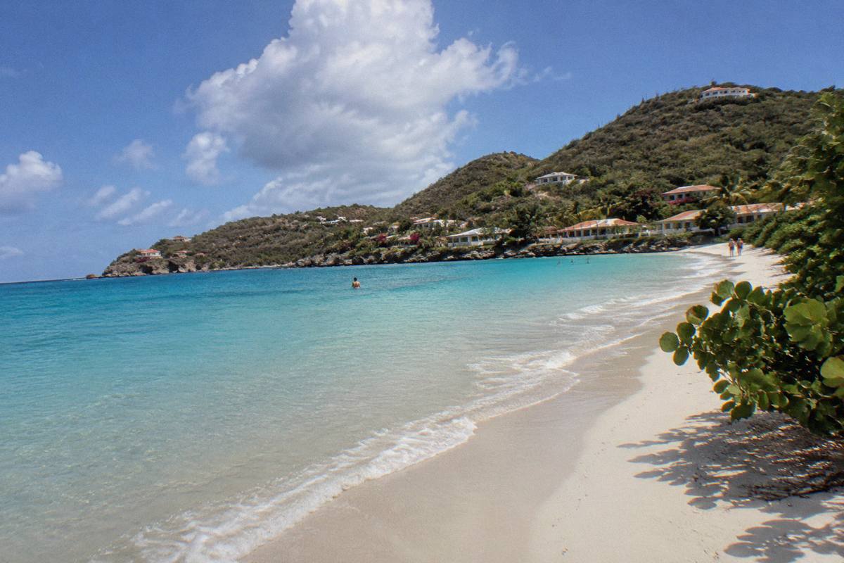 White sand beach and calm shallow water along a Saint Barthelemy shoreline