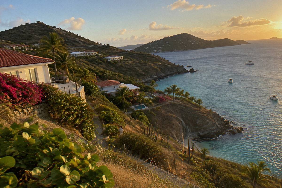 Hillside villas with terraces above a rocky Caribbean coastline