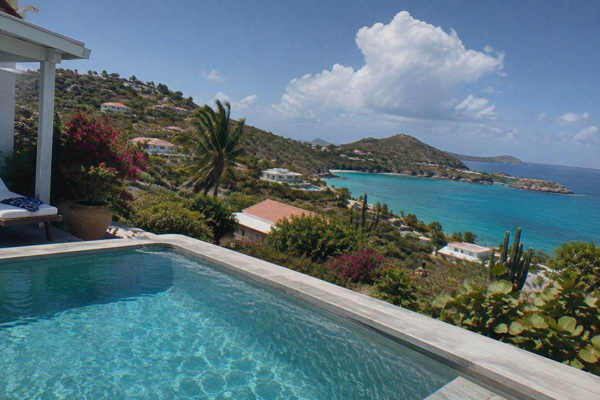 Private pool terrace at a hillside villa overlooking the sea