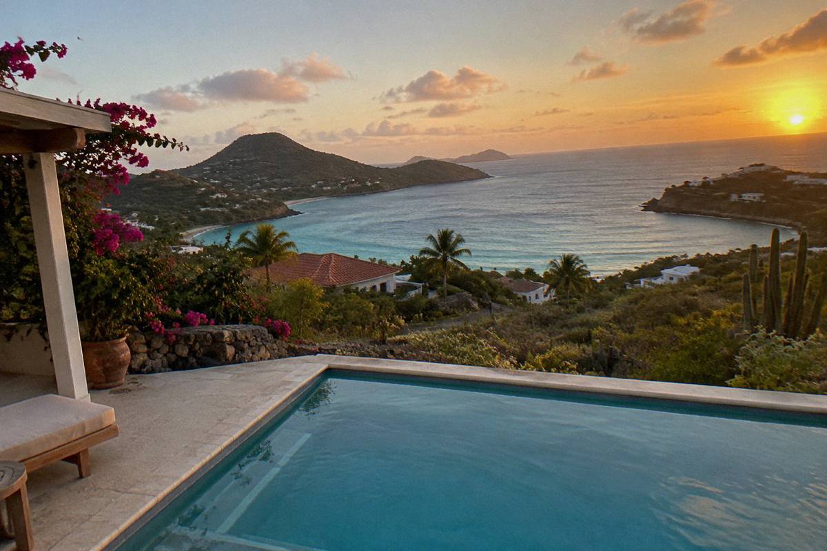 Private villa terrace with an empty swimming pool overlooking the sea