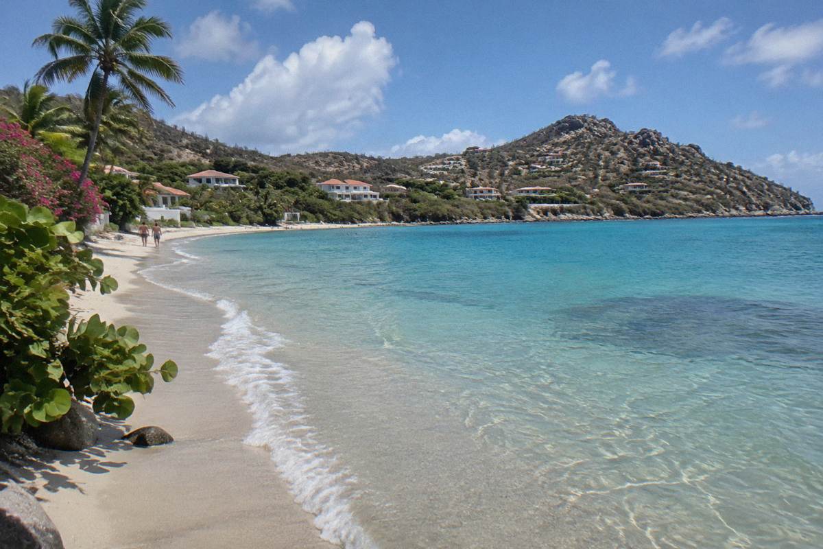 Shallow calm water along a sandy Caribbean beach at midday
