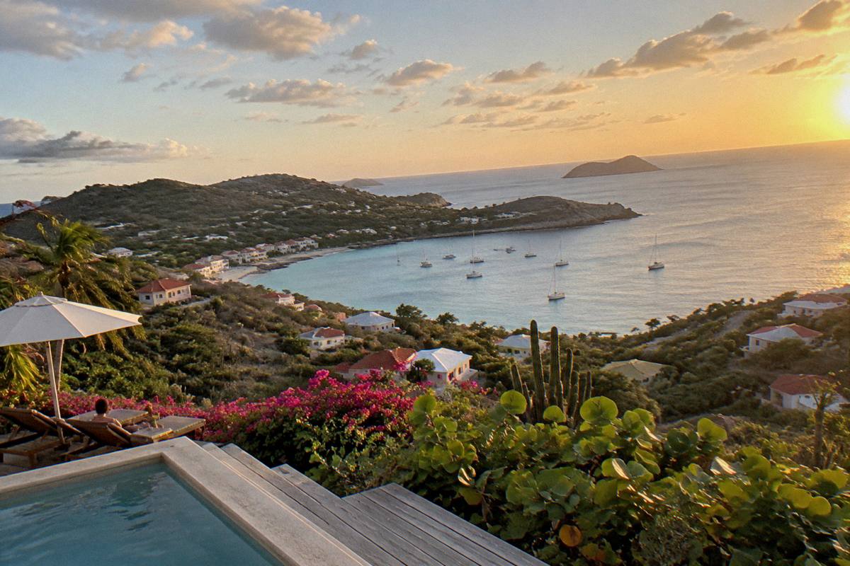 A hillside hotel terrace with wide views over the Caribbean sea