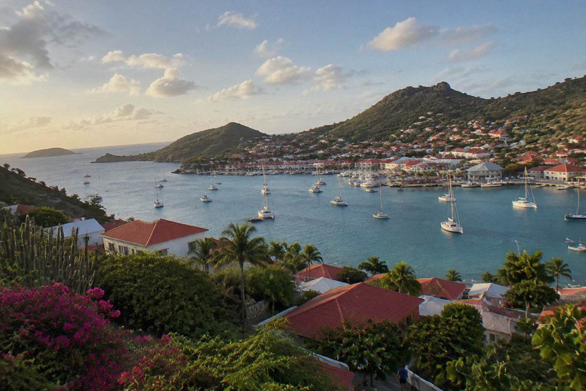Evening light on the rooftops of Gustavia with masts in the harbour below