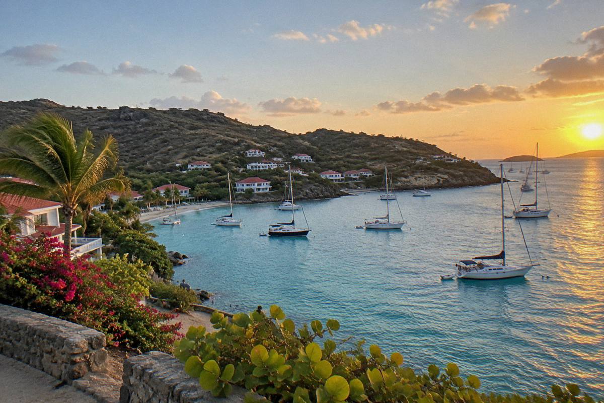 Sunset over anchored sailing boats in a small Caribbean harbour