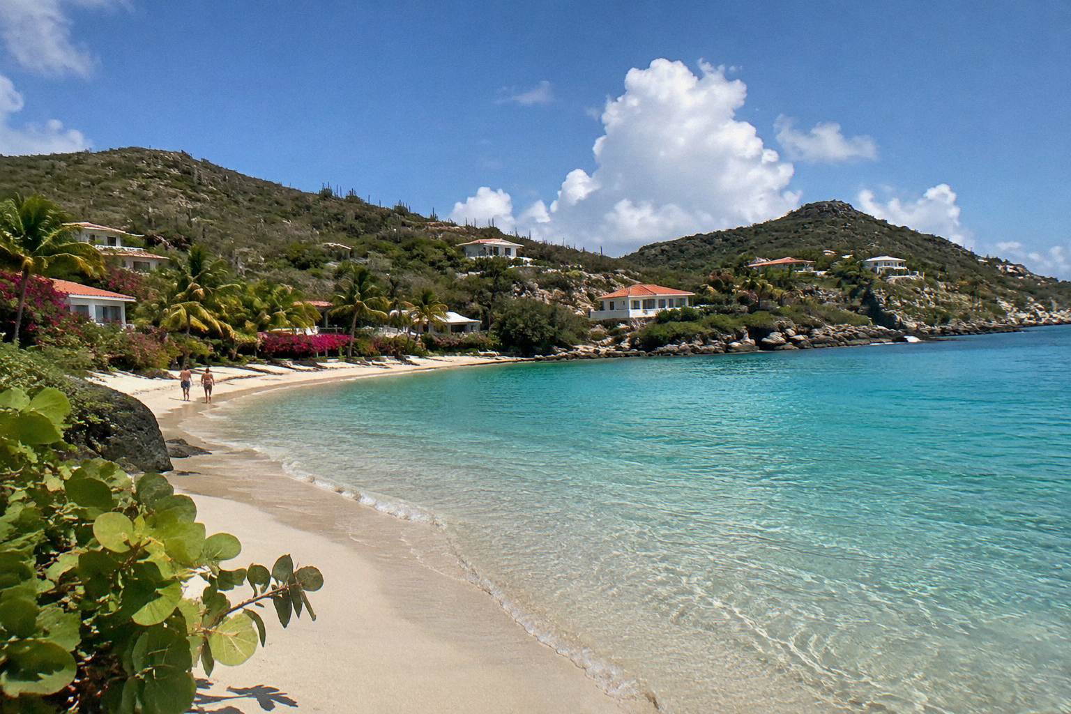 A quiet curve of pale sand and clear shallow water on a small Caribbean island
