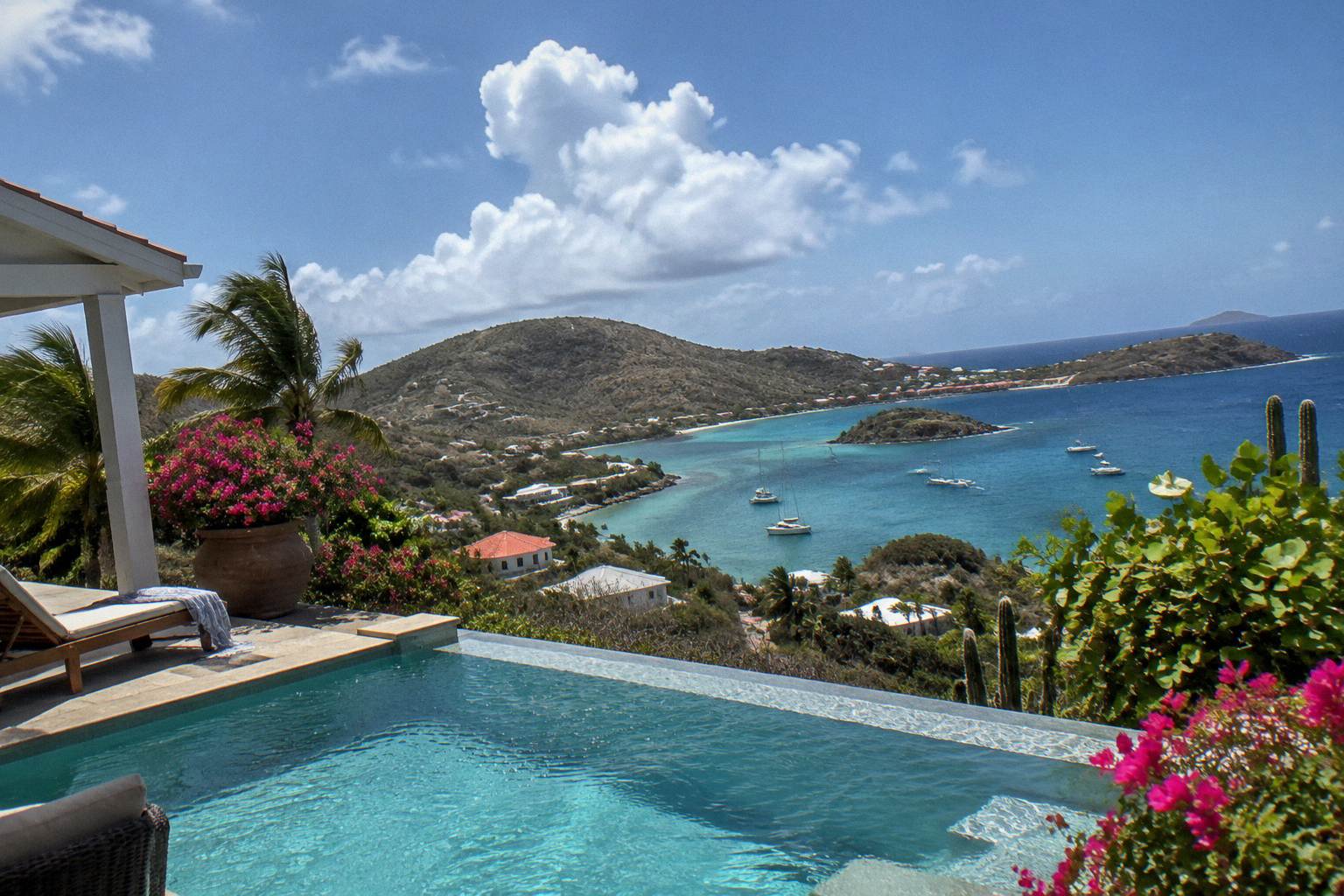 Private villa pool terrace above the coastline of Saint Barthelemy at late afternoon